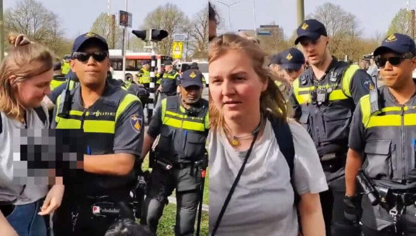 Bizarre beelden tonen hoe politieagent onverwachts de fout ingaat bij vrouwelijke klimaatactivist